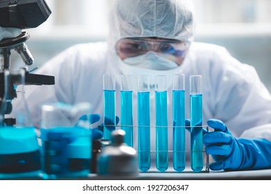 Researchers Scientist Working Analysis With Blue Liquid Test Tube In The Laboratory, Chemistry Science Or Medical Biology Experiment Technology, Pharmacy Development Solution