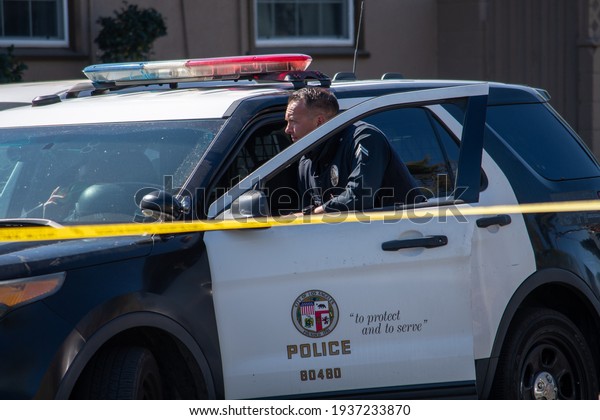 Reseda, California, United States - February 24,\
2021:  LAPD Swat team, officers, and LAFD Firefighters and\
helicopters respond to a report of a gunman in a Reseda.  One\
suspect was taken into\
custody