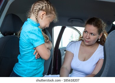 Resentful Child Refusing Get In Safety Car Seat Under Mother Severe Look