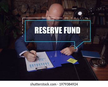  RESERVE FUND Inscription On The Screen. Broker Inspecting Market Data. A Savings Or A Liquid Asset Set Aside To Cover Unexpected Costs Or Future Financial Obligations
