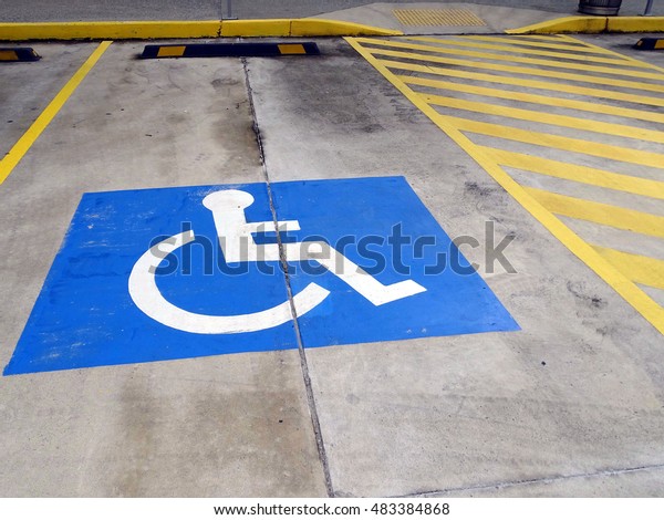 Reserved car\
parking space for handicapped\
people
