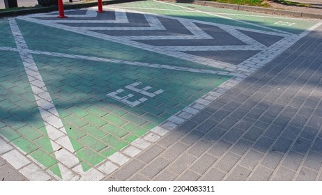 Reserved Empty Parking Spot With Charger For Electrical Vehicles