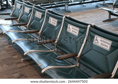 Reserved front row seating area for people with physical handicaps in Sarasota, Florida airport.