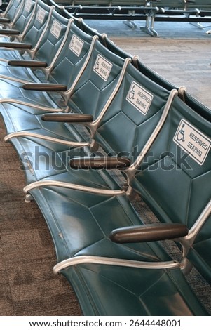 Reserved front row seating area for people with physical handicaps in Sarasota, Florida airport.