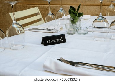 Reserved label on the table of an outdoor restaurant in an Italian city - Powered by Shutterstock