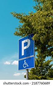 Reserved Parking Space Sign, Handicapped Person With Disability In Wheelchair Pictogram, Selective Focus