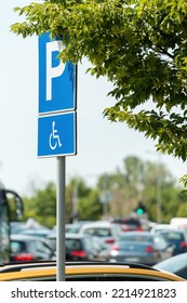 Reserved Parking Space Sign, Handicapped Person With Disability In Wheelchair Pictogram, Selective Focus