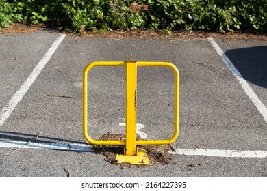 Reserved Parking Space With Yellow Metal Barrier