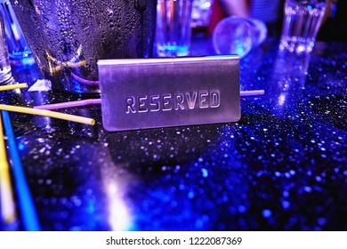 Reserved Sign On A Table At Night Club