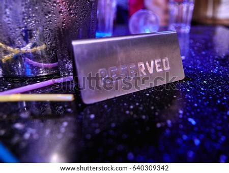Reserved sign on a table at night club Stock photo © 