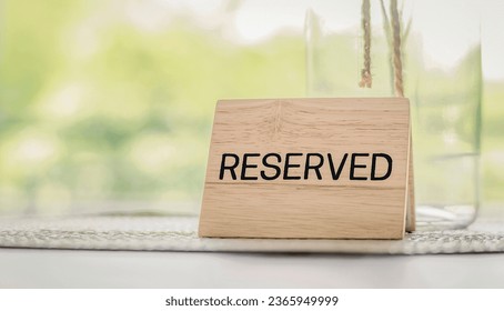 Reserved sign on the table. Restaurant reservation service.