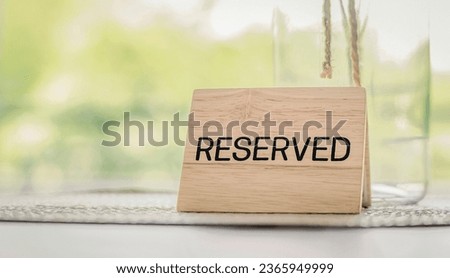 Reserved sign on the table. Restaurant reservation service. Сток-фото © 