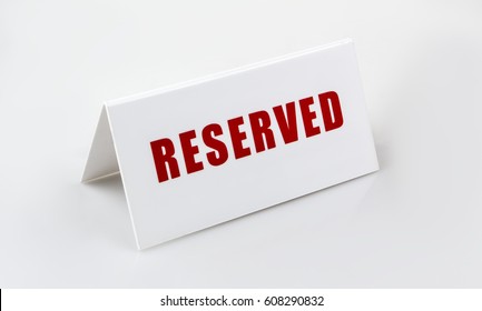 Reserved Sign Standing On The White Background. Letters Are Red. 