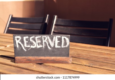 Reserved Table. The Reserved Logo. Booking Badge. Wooden Reservation Sign. Reserved Table In The Restaurant. Hungry. Busy.