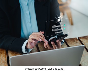 Reset password successful concept. Lock icon, security code showing on change password page on smart mobile phone hold by businesswoman. Cyber security technology on application for data protection.