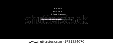 RESET, RESTART and REOPENING concept, Loading sign on black computer screen