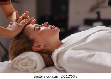 reset tired body. girl enjoys professional massage. close up side view photo. soothing the muscles - Powered by Shutterstock