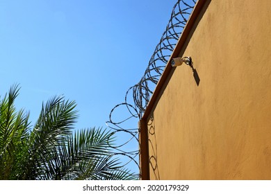 Residence Surrounded With Very Sharp Steel Wire Tape. Very Efficient To Fight Home Burglaries. Total Security With Security Camera And 24 Hour Watch. Private Area , Safety And Security Concept .
