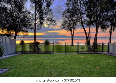 Residental Backyard With An Ocean View At Sunset