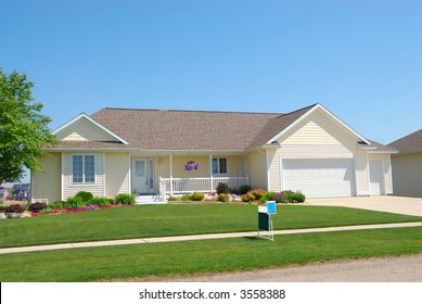 Residential American Ranch House - A Residential Suburban Home In An Upscale Neighborhood In The Summertime.