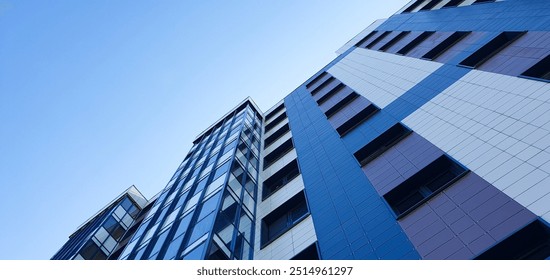 A residential apartment building from top to bottom. Commercial real estate, building. Buying, renting real estate. City apartments. - Powered by Shutterstock