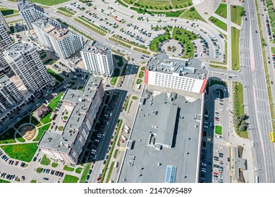 Residential Area With Apartment Buildings, Shopping Mall And Carpark With Parked Cars. Aerial View.