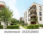 Residential area with ecological and sustainable green residential buildings, low-energy houses with apartments and green courtyard