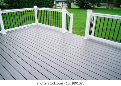 Residential Backyard Gray Composite Deck - Shutterstock ID 1551891023