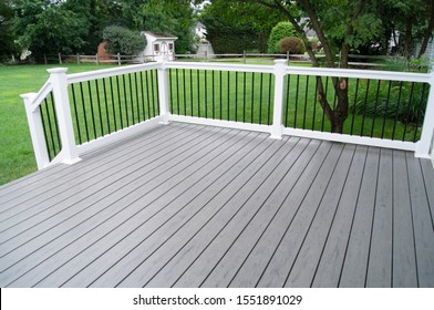 Residential Backyard Gray Composite Deck - Shutterstock ID 1551891029