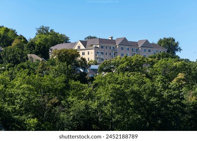Residential building complex surrounded by a verdant landscape on a summer day, Brighton, MA, USA
