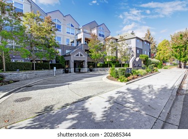 Residential Building With Landscape. View Of Welcoming Sign In Park Avenue Apartment Complex