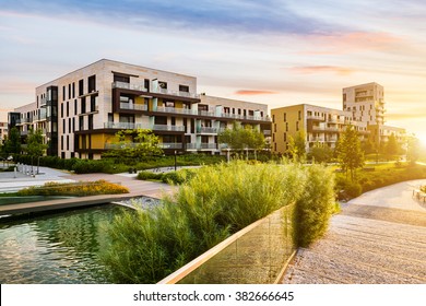 Residential building in the public green park during sunrise - Powered by Shutterstock