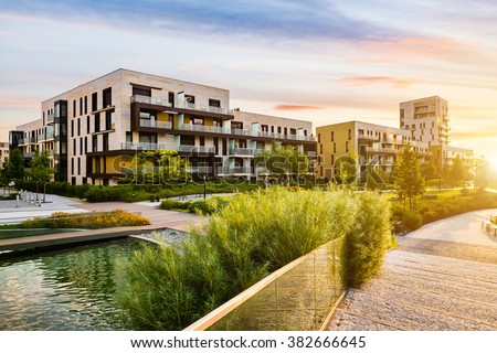 Residential building in the public green park during sunrise Stock foto © 