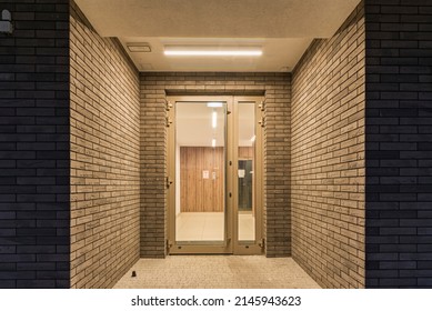 Residential Buildings In The City At Night. Main Building Entrance, Stairwell With Intercom And Hallway.