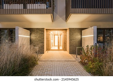 Residential Buildings In The City At Night. Main Building Entrance, Stairwell With Intercom And Hallway.