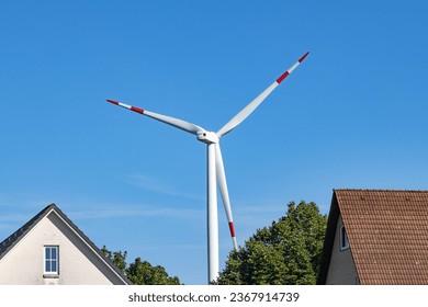 Residential buildings in Hamburg with a wind turbine in the background - Powered by Shutterstock