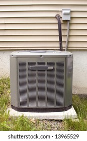 A Residential Central Air Conditioning Unit Sitting Outside.