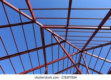 Residential Construction Home, Steel Beams With Blue Sky At Construction Site