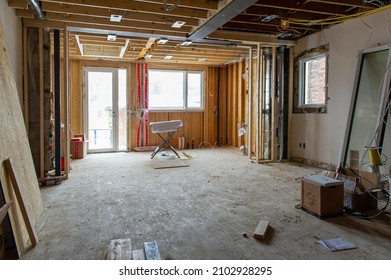 Residential Construction Site Of A House In Toronto, Ontario- Canada. Welded Steel Beam Is Visible On The Ceiling. Construction Tools, Material Supplies And Design Plans. Real Estate Home Remodeling.