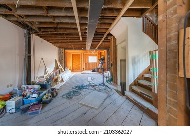 Residential construction site of a house in Toronto, Ontario- Canada. Welded Steel beam is visible on the ceiling. Construction tools and material supplies. Real estate home remodeling.