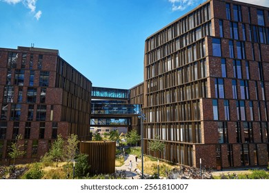 Residential district in Copenhagen, Denmark. Modern city architecture with eco friendly buildings. Urban setting with contemporary office buildings and walking people - Powered by Shutterstock