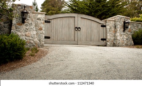 A Residential Entry Gate And Driveway.