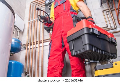 Residential Furnace System Technician at Work. Check and Repair HVAC Systems. Worker with His Toolbox. Industrial Theme.