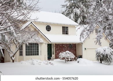 Residential Home.  Average American Two Story Residential Home Covered With Snow During Winter Storm.