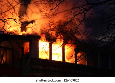 Residential Home On Fire, Fully Involved, Engulfed In Orange Fire And Flames