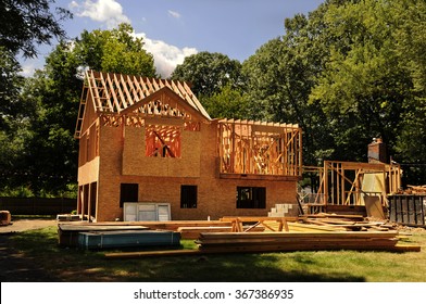 A Residential Home Under Construction Mid Framing And Sheathing