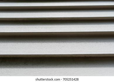 Residential Home Vinyl Siding Texture Background. Protection From Weathering And Water Damage.