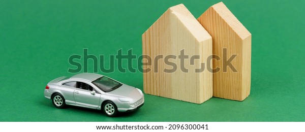 Residential house and car purchase concept:\
house and car mockup on green\
background