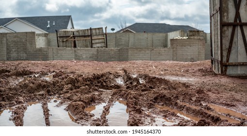 Residential House Construction Under Rain Delay With Mud And Tracks