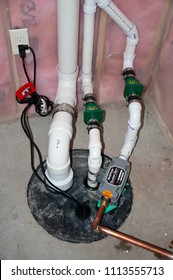 Residential House, Sioux Falls, South Dakota, USA - 6/12/2018: Sump Pump Manhole With Water Backup And Radon Mitigation